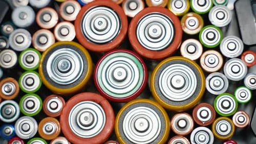 Rows of Used Alkaline AA AAA D Batteries Lithium Ion Battery Pack Close Up