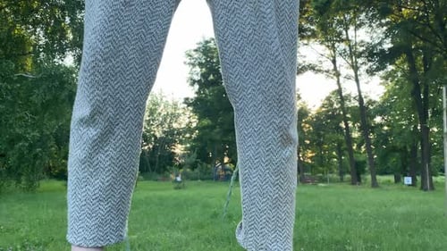 Barefoot Female Person Finds Equilibrium on Playground Outdoors
