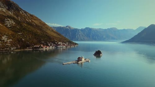 Stunning aerial view of Church of Our Lady of the Rock near Perast city of Boka Kotor bay