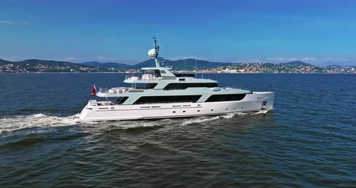 Aerial View Tracking of Beautiful Modern White Superyacht Lifestyle Luxury Boat Sailboat