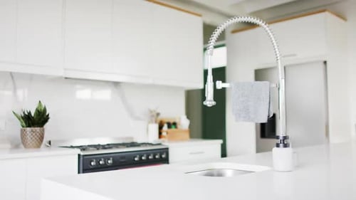 Close up of sink and equipment in kitchen, slow motion