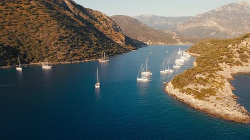 Yachts anchored in the bay with crystal clear sea water