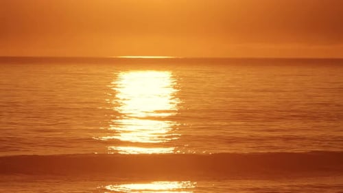 A Path of Sunlight on the Sea Surface at Orange Sunset