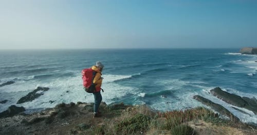 Female Hiker in Epic Cinematic Coast Scenery