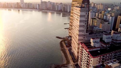 Coastal Cityscape at Sunrise, Aerial Beach View