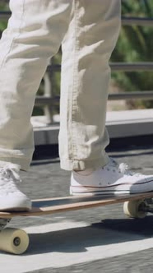 Legs, man and skateboard on bridge in city for commute, eco friendly transport and adventure