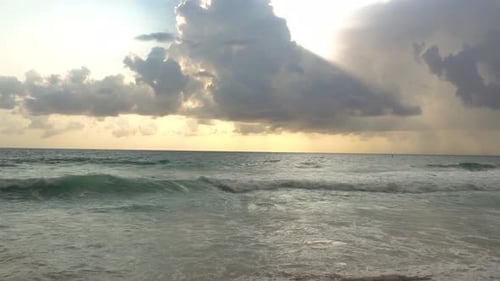 Large Rain Clouds Over the Raging Sea at Sunset