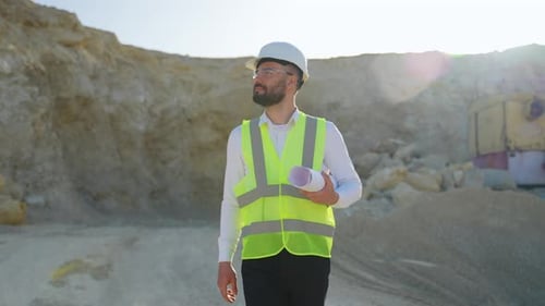 Engineer Geologist Walking At Quarry