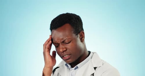 Stress headache, black man or doctor in studio with fatigue, burnout and frustrated healthcare