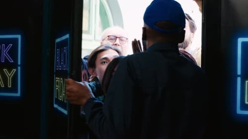 Crowd of Shoppers Pushing Through Store Doors