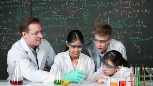 Students and Teacher Conduct Chemistry Experiment in Classroom
