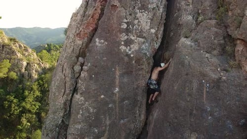Climbing couple man and woman in the mountain. Drone view of climber sportsmen.Physical activity in