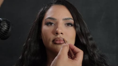 A Comprehensive Beauty Makeup Application for a Model in a Professional Studio Setting