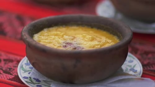 Hot Boiling Argentine Humita Peasant Dish Served in a Casserole, Close Up