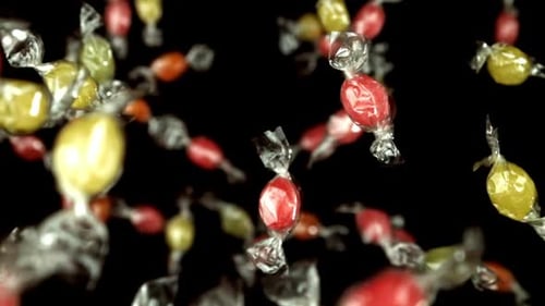 Colorful Wrapped Candies Floating on Black Background