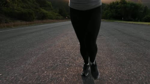 Road Runner Woman Running on Road in the Morning