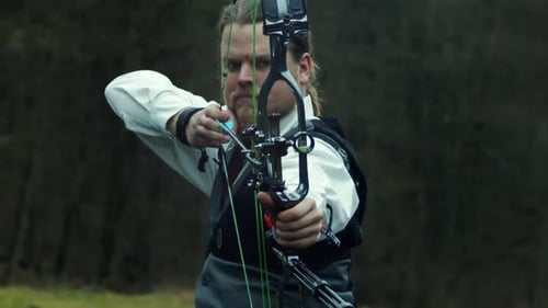 Business man in dress shirt vest and tie draws bow and arrow, 120fps