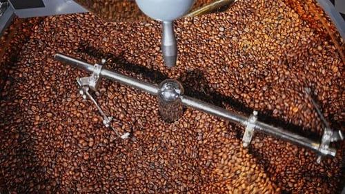 Roasted Coffee Beans Stirring in a Machine