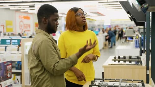 Couple Shopping for Kitchen Appliances in a Store