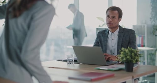 Business Meeting in Bright Modern Corporate Office