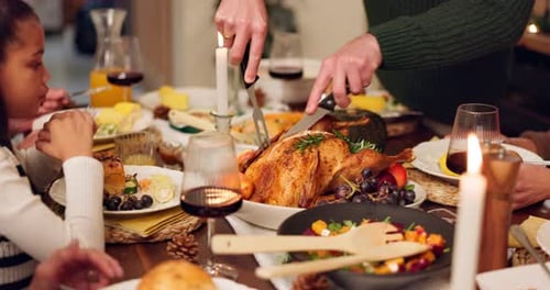 Family Gathering Around Festive Holiday Dinner Table