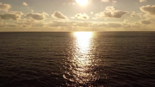 Aerial View on Warm Sunset Over Calm Sea