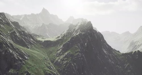 Majestic Mountains Rise Against a Luminous Sky in a Breathtaking Landscape