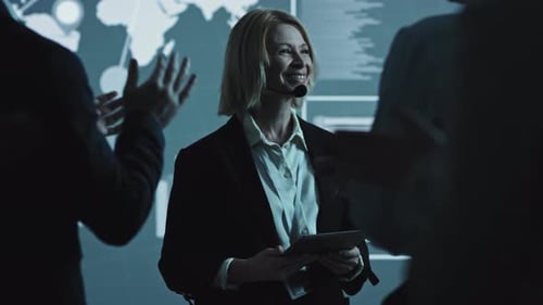 Woman Presenting Global Business Data at Conference