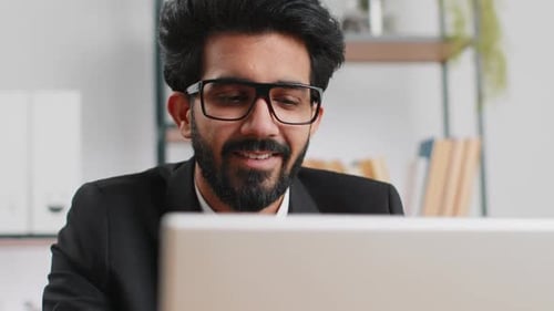Closeup Businessman Freelancer at Office Workplace Working on Laptop Computer Sends Online Messages
