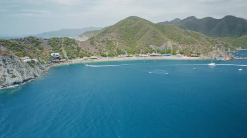 Aerial view of Active Beach, Speedboats, and Touristic Towers – Playa Blanca, Santa Marta