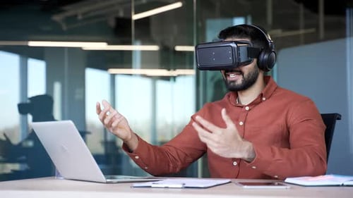 Man Using VR Headset in Modern Office