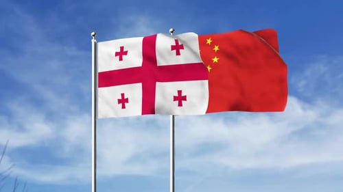 Realistic Waving Flags of Georgia and China on a Clear Sky