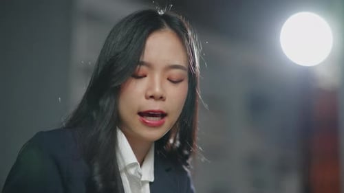 Lawyer Reads Documents in Office at Desk