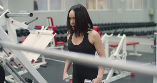 Deltoid Workout with Dumbbells Video of a Fit Caucasian Woman During Gym Workout