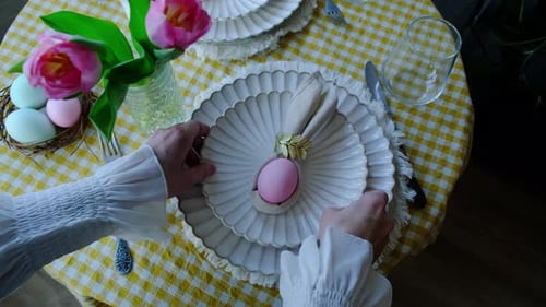 Easter Table Setting with Tulips and Painted Eggs
