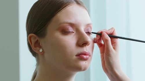Makeup Artist Work in Her Beauty Studio Portrait of Woman Applying By Professional Make Up Master