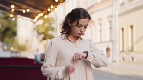 Woman Checking Watch Realizing She is Late