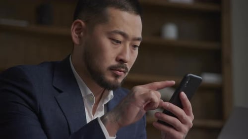 Businessman Browsing on Smartphone