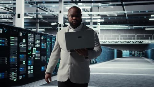 Data Center System Administrator Reviewing Code for Automation Scripts