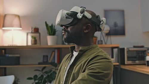 Man Wearing VR Headset at Home