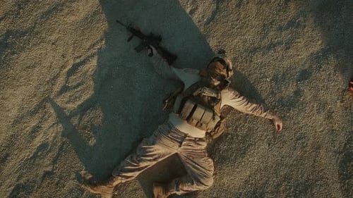 Flying over Group of Dead Soldiers in Desert Area. Zooming Out.