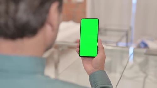 Close Up of Mature Adult Man Using Phone with Green Screen