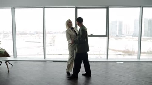 Elegant Mature Couple Dances Together Indoors
