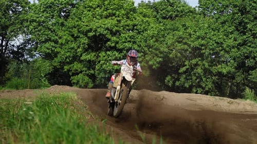 Motocross Riders Riding Dirtbikes in Rural Area