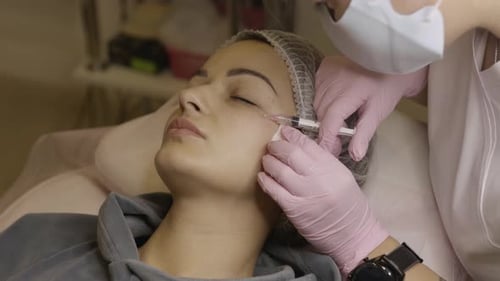 Woman Receives Cosmetic Injection at Medical Spa