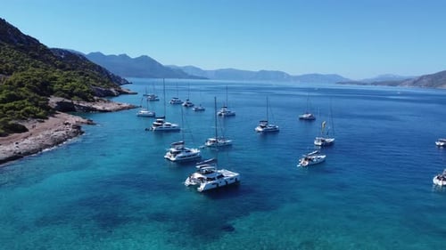 Sailboats in the sea during the summer aerial shot 4k