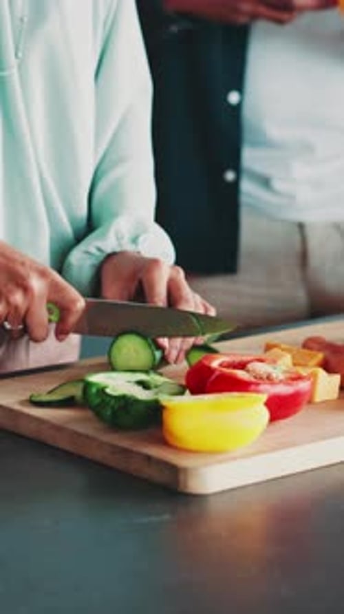 Adults Preparing Vegetables on Wooden Cutting Board
