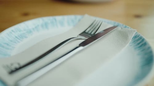 Table Setting with Blue Plate, Fork, and Knife