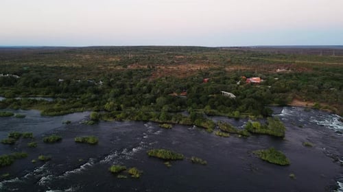 Aerial fly over view of the mighty Zambezi River flowing down to the Victoria Falls