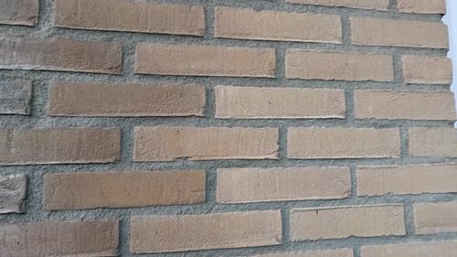 Shot of bricks in a wall forming a house.